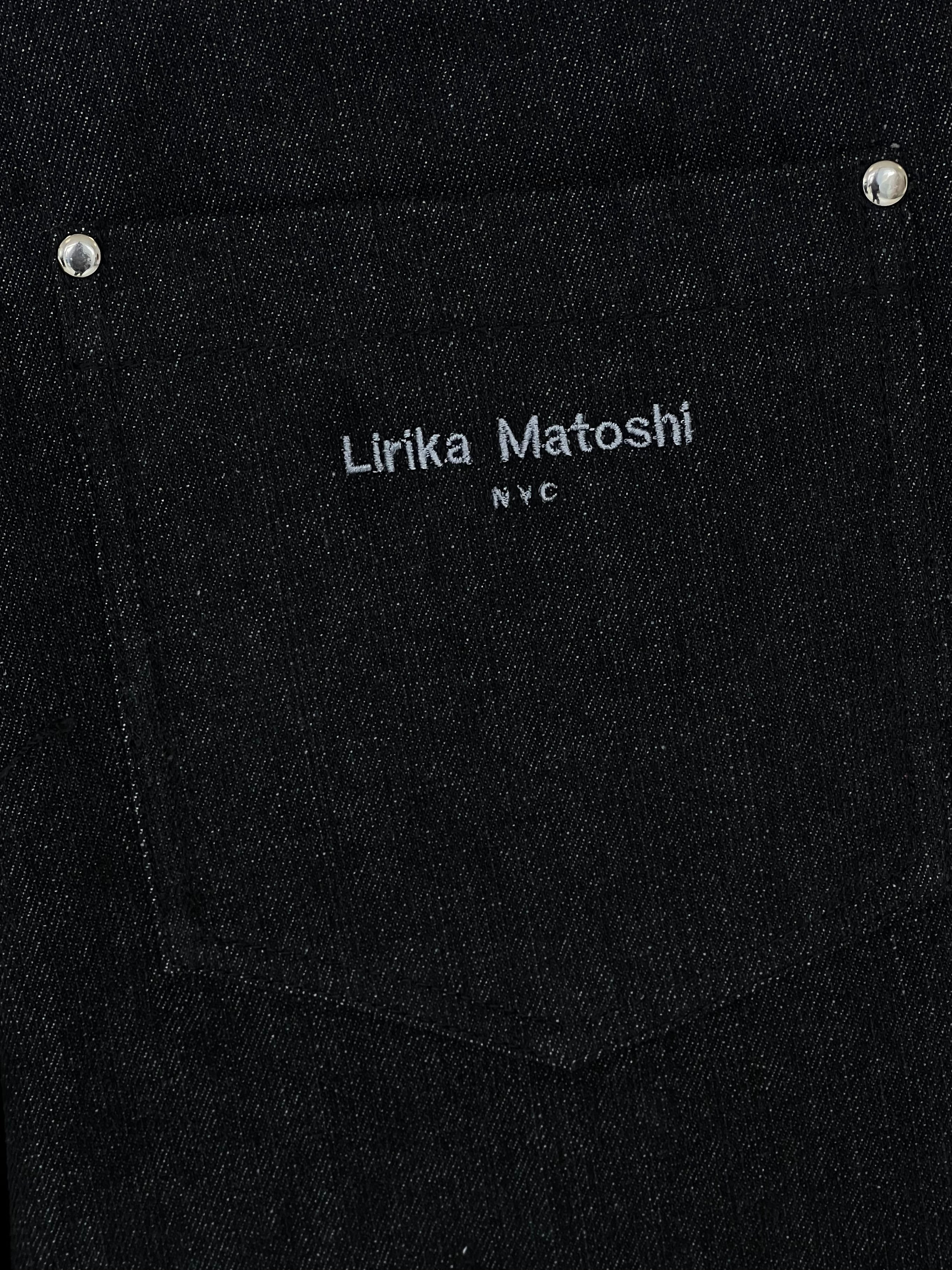 Black denim pants with silver hoops