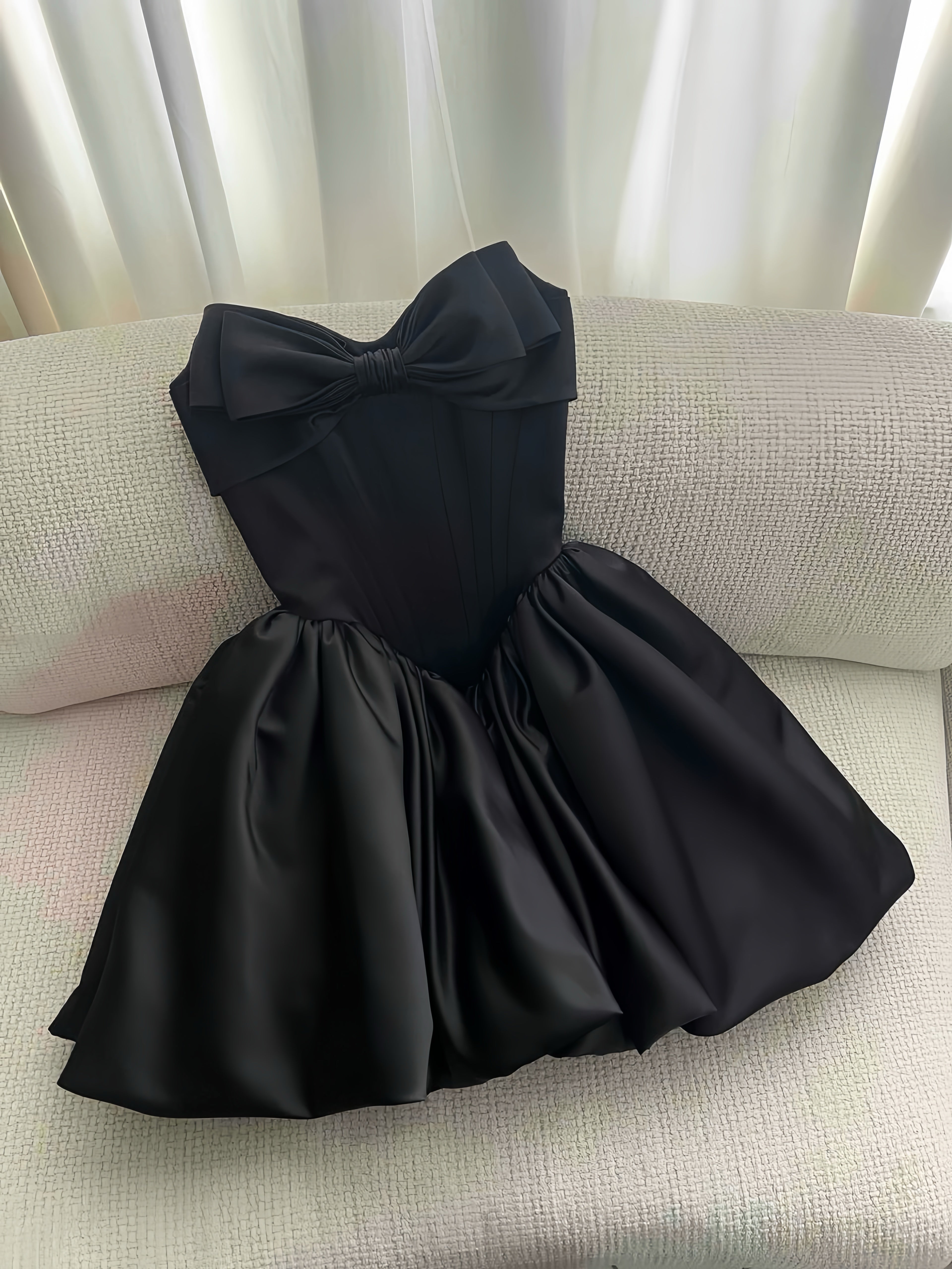 Black mini dress with a large bow