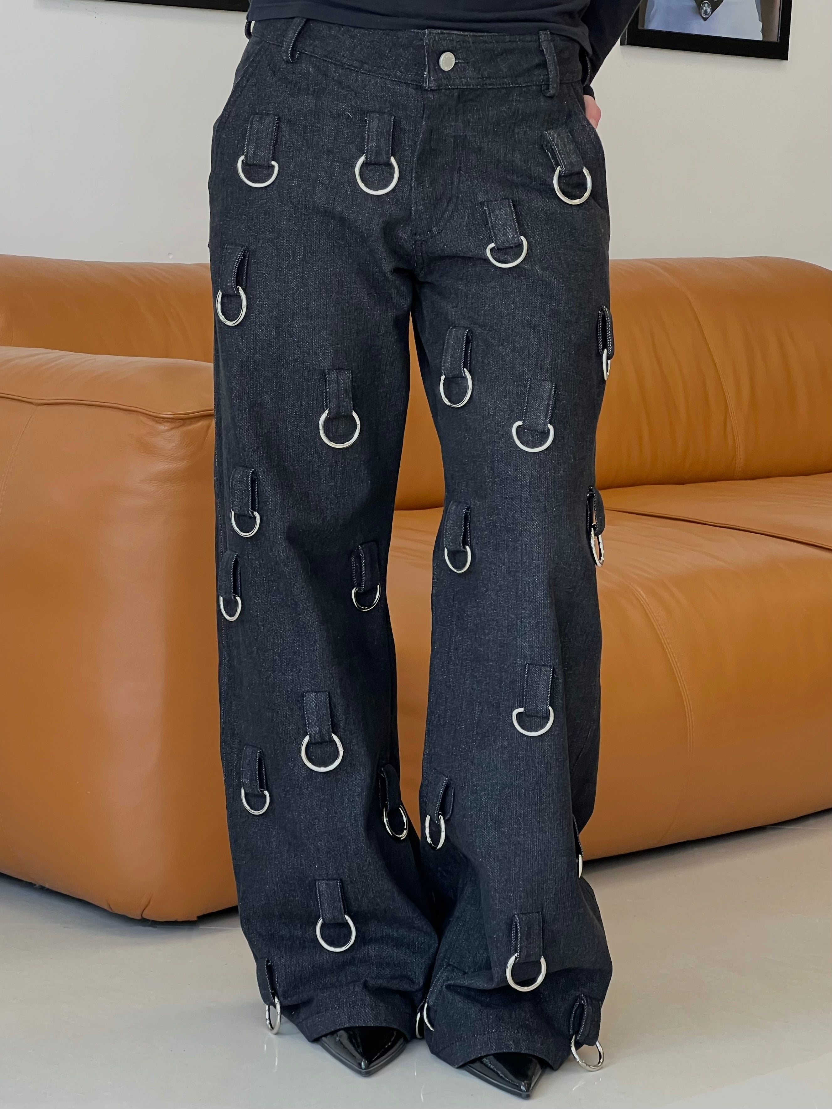 Black denim pants with silver hoops