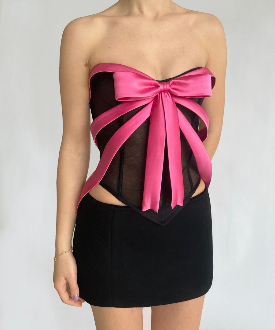black corset with pink bow