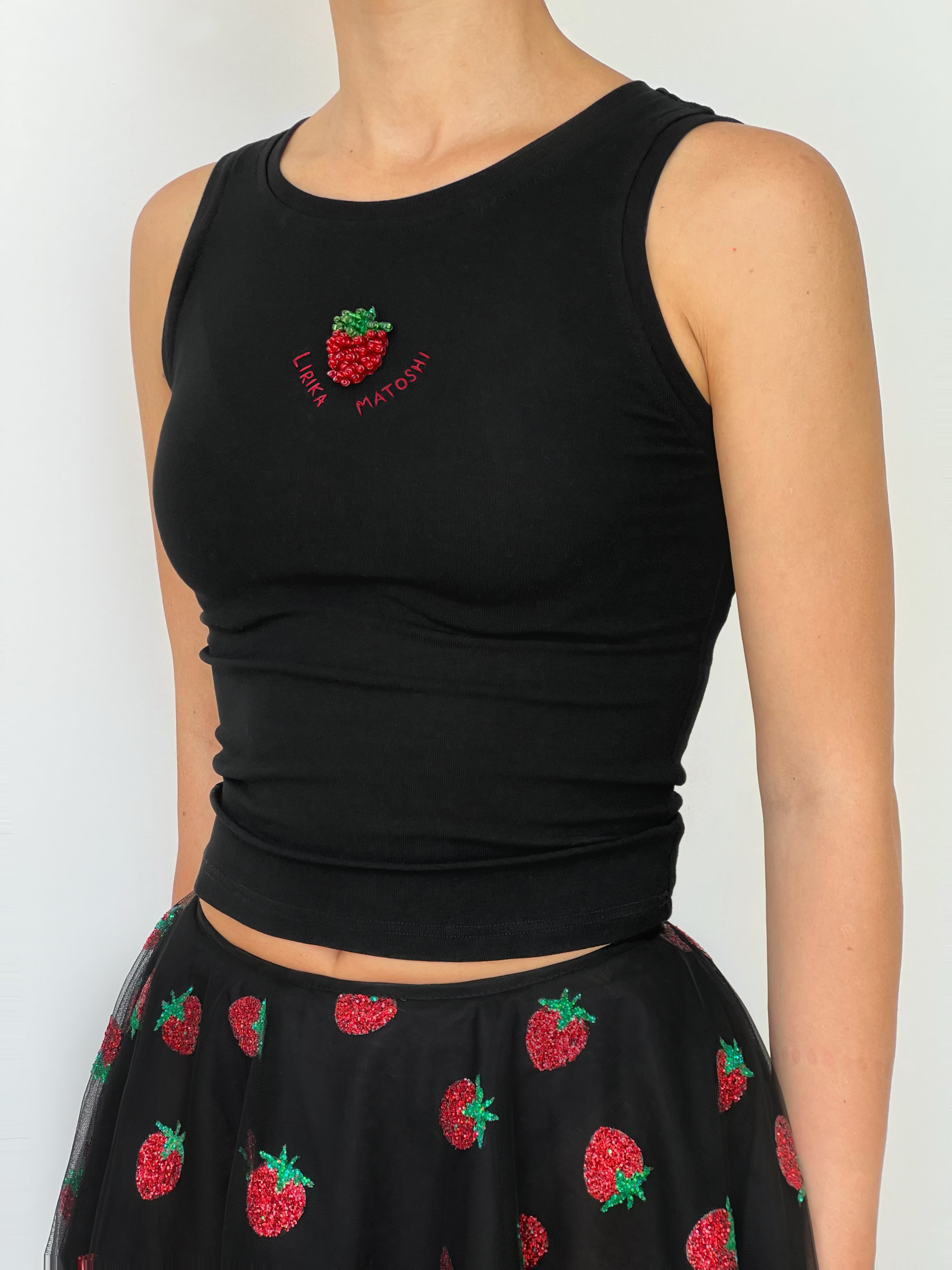 Black tank top with strawberry design and text