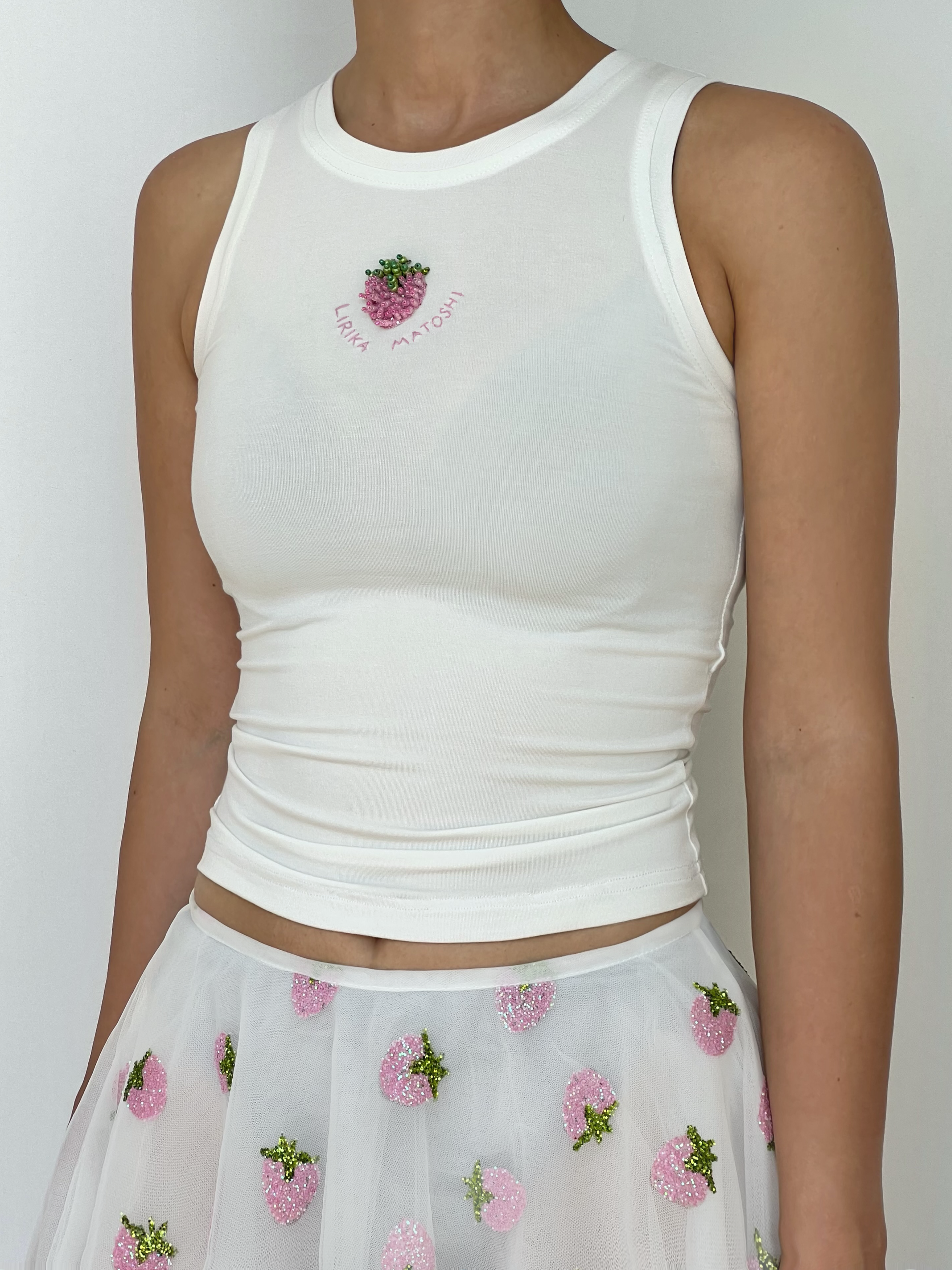 White tank top with pink strawberry design and text