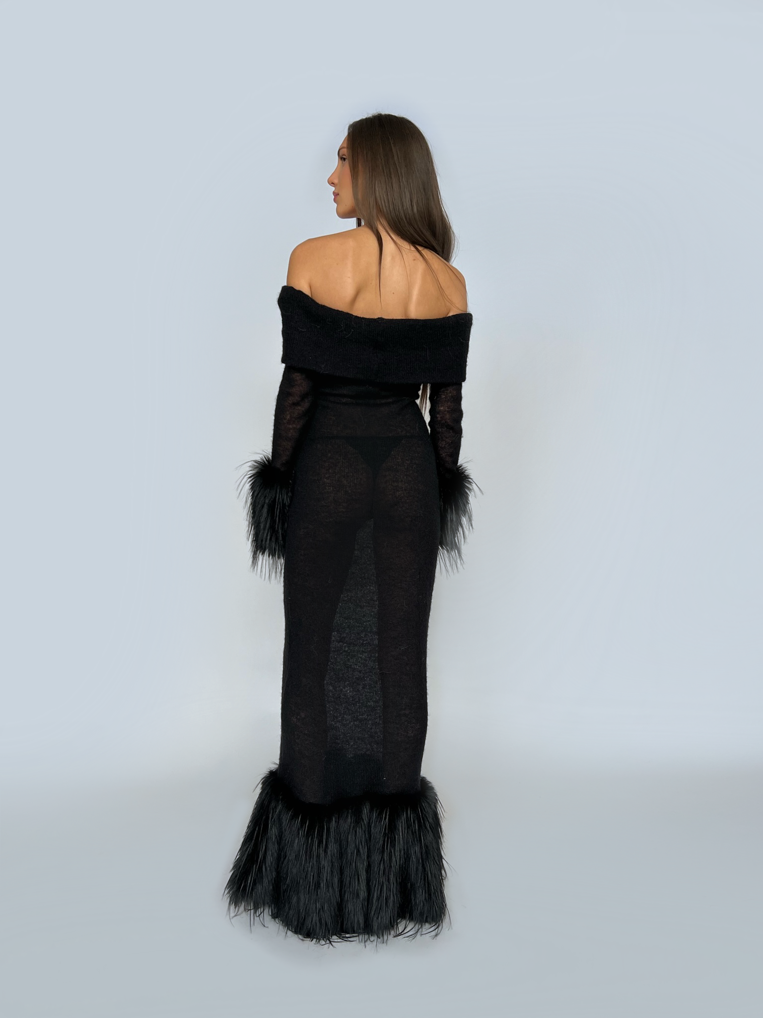 Black sheath dress with fur and long off the shoulder sleeves