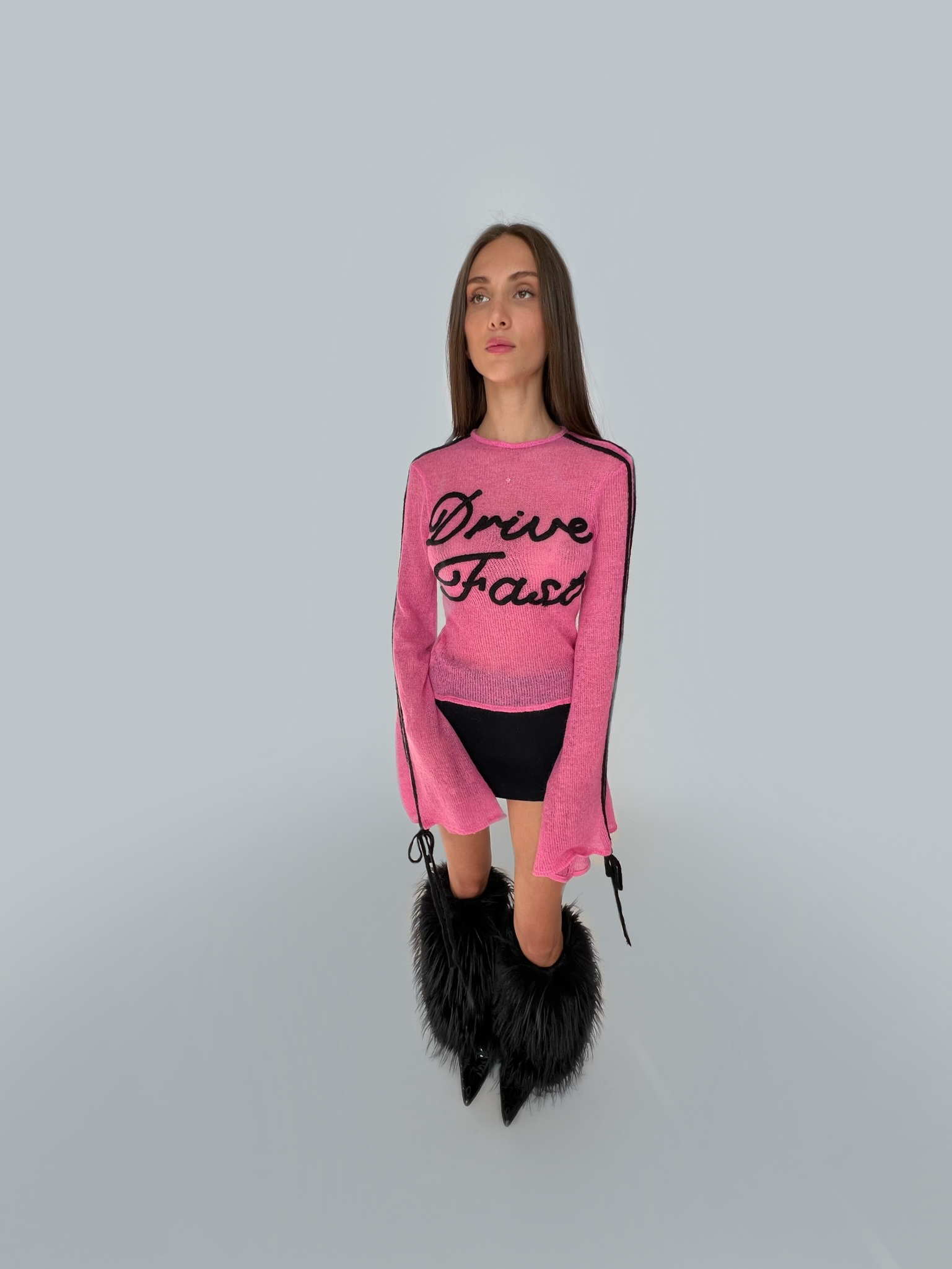 Pink sweater with writing and long sleeves