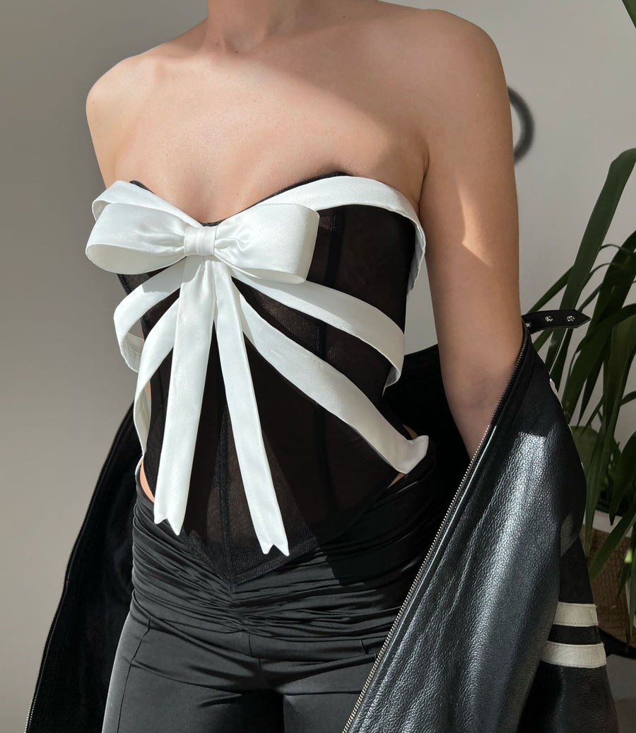 black corset with white bow