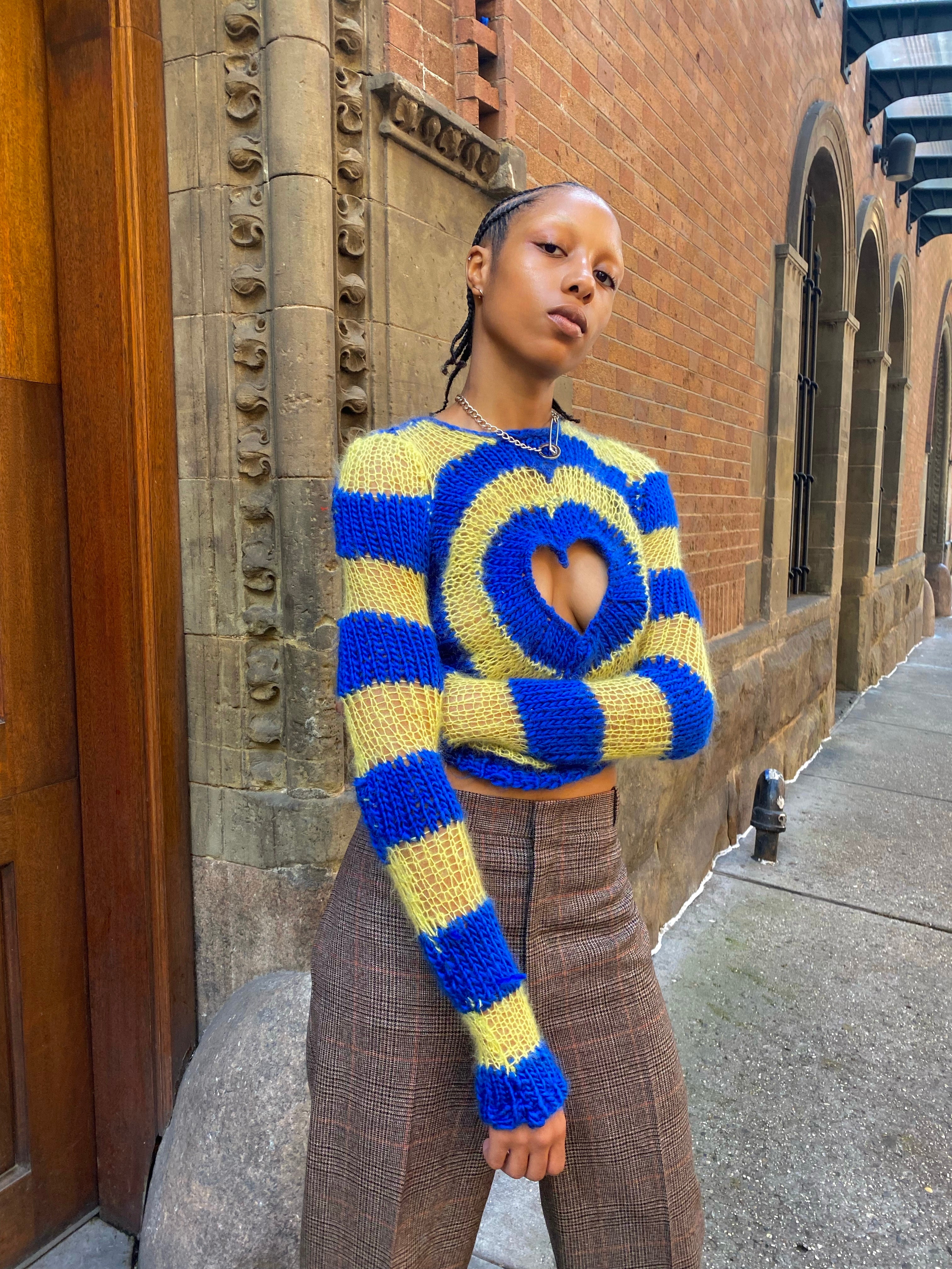 blue and yellow hand knitted heart sweater