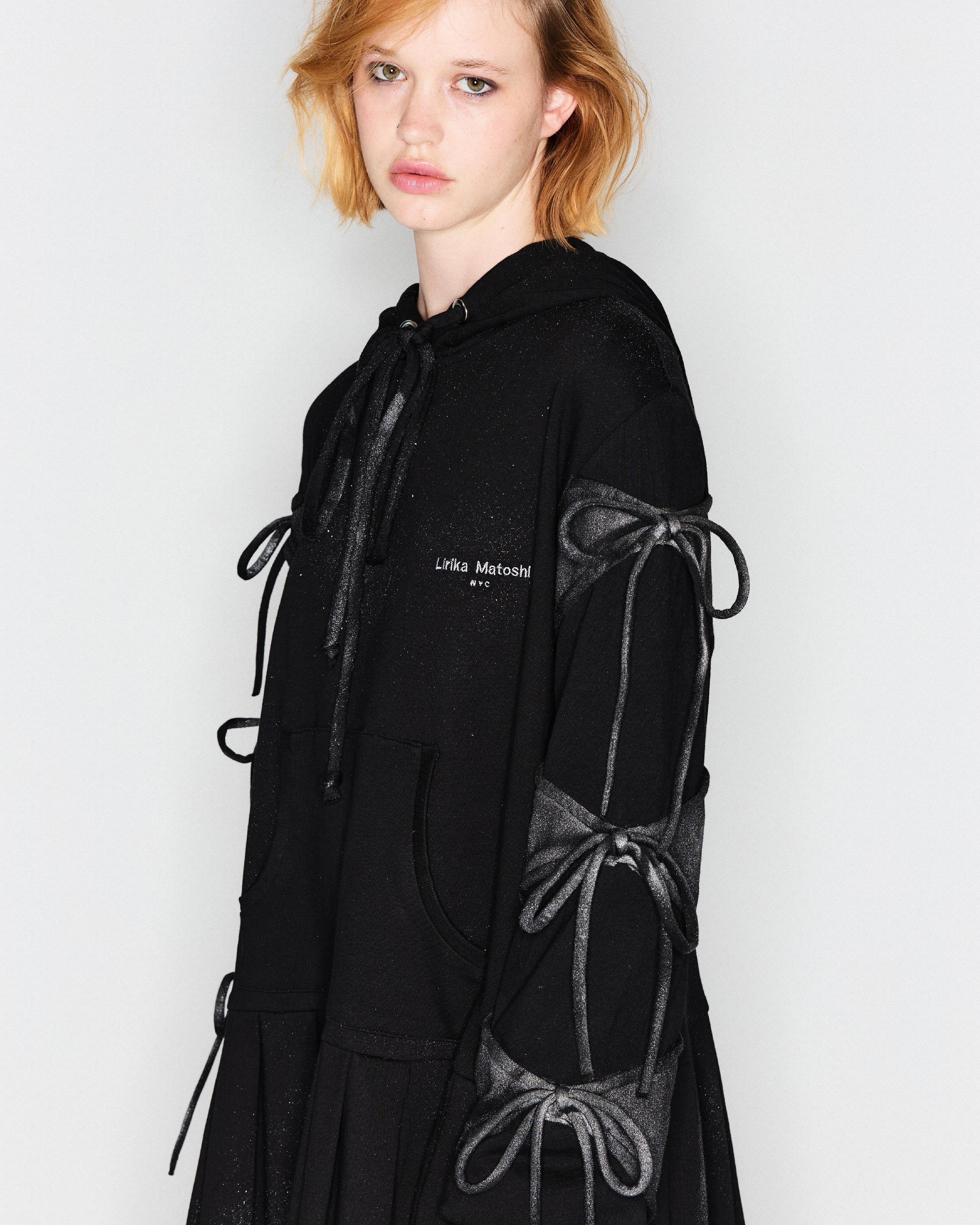 black sweatshirt dress with bows and long sleeves