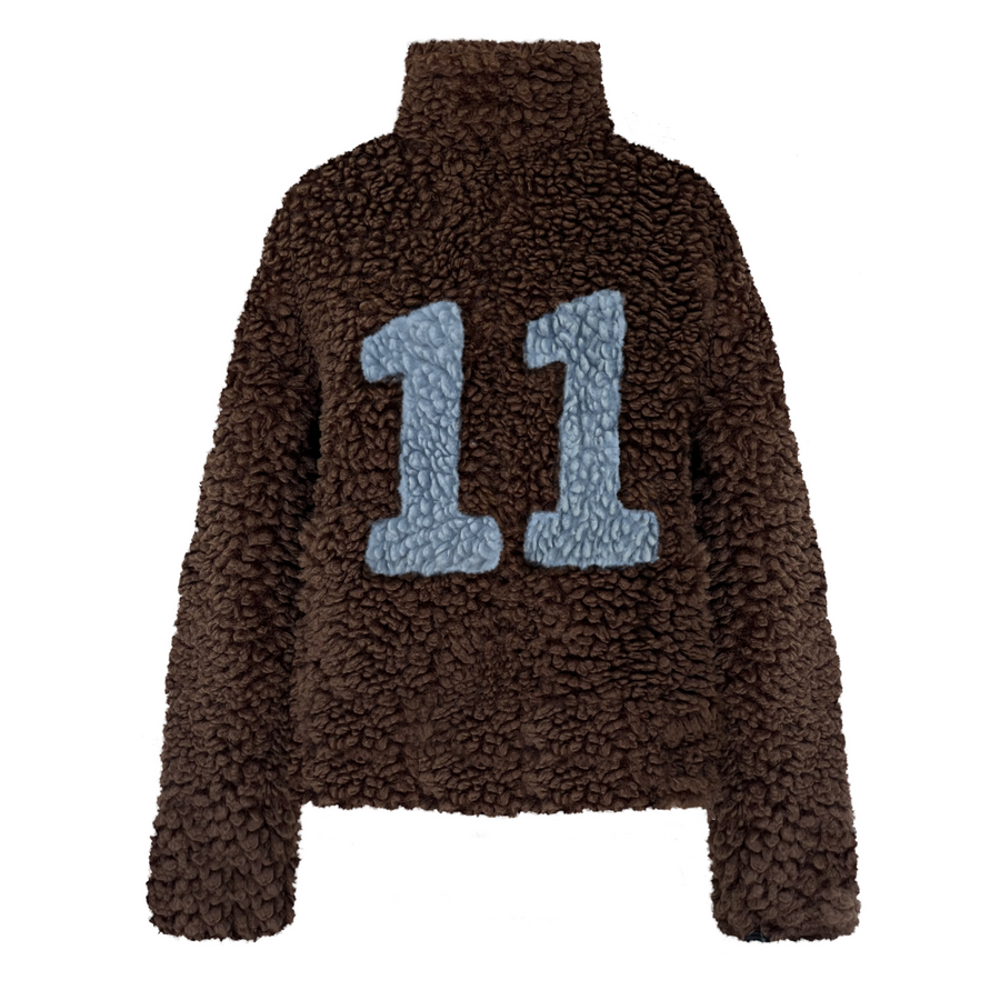Brown fuzzy fleece jacket with large blue number '11' 