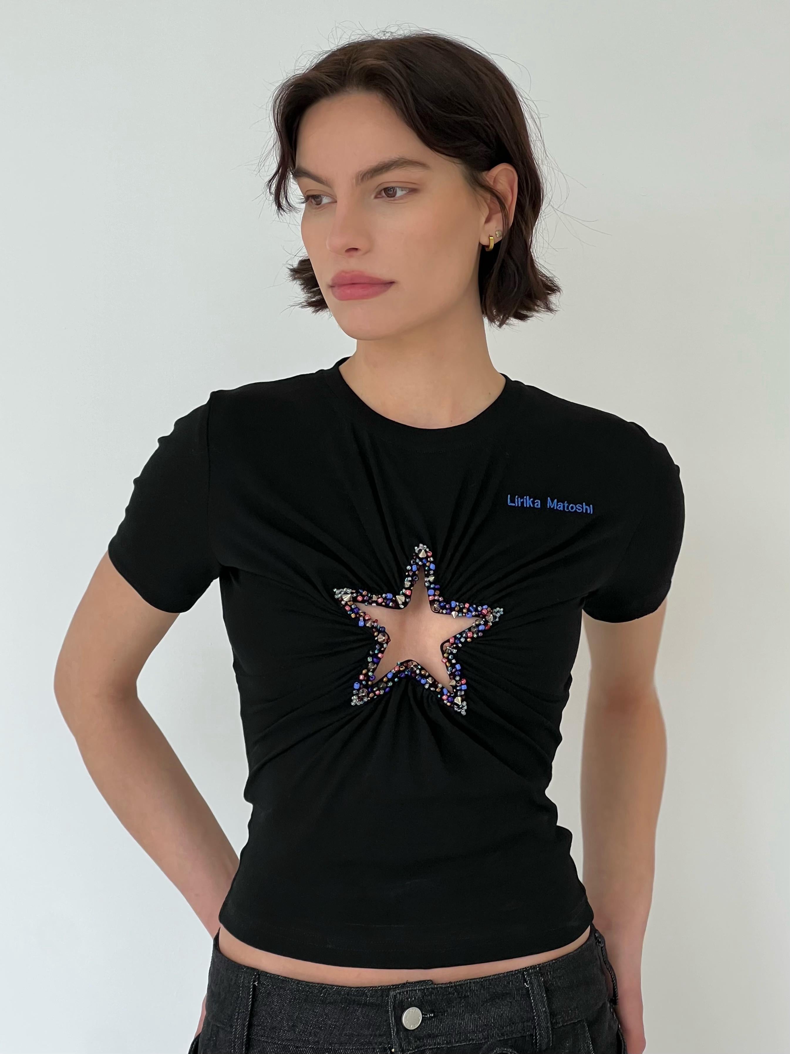 Black t-shirt with a colorful star design and embroidered brand logo
