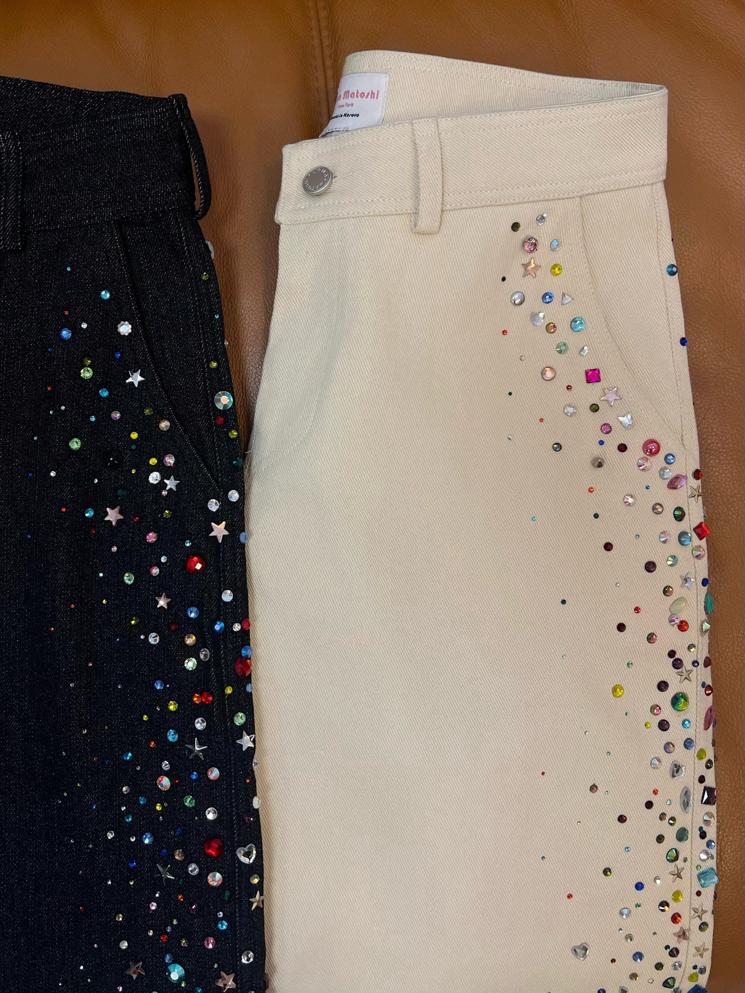 Beige jeans with colorful embellishments