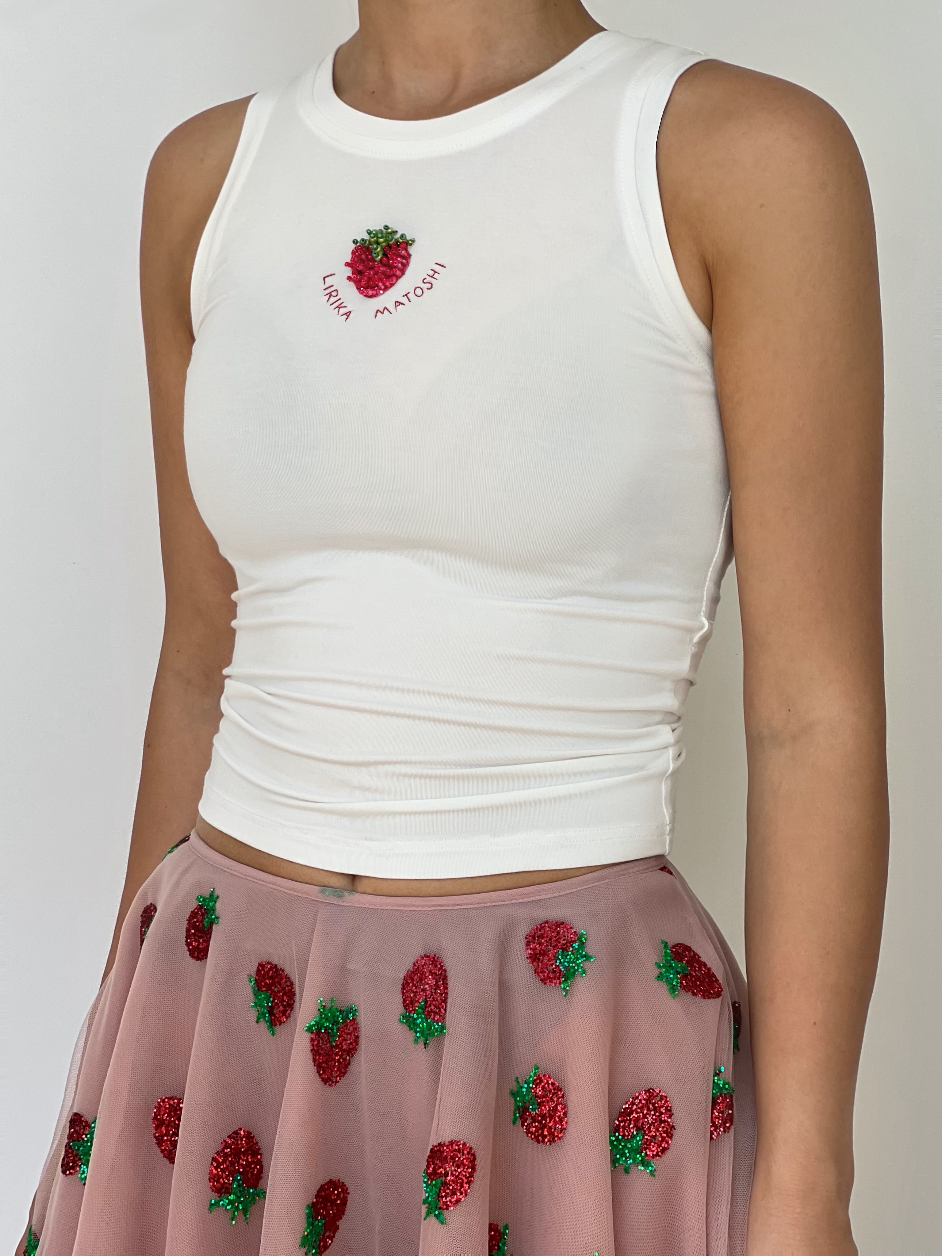 White tank top with red strawberry design and text