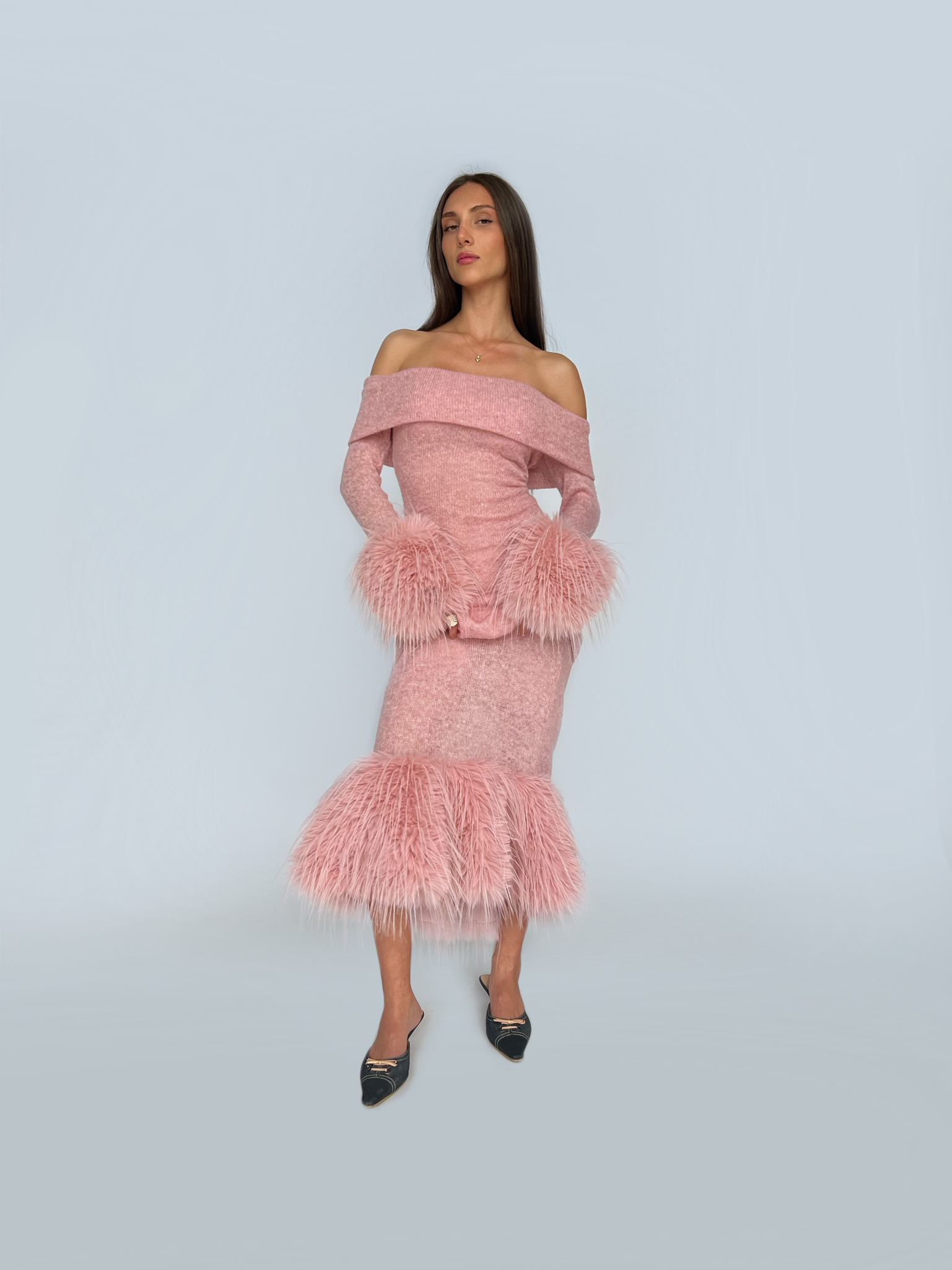 Pink sheath dress with fur and long off the shoulder sleeves
