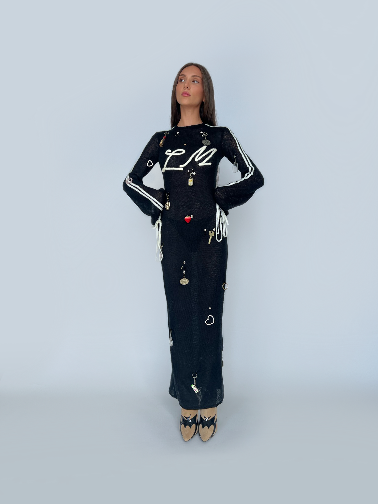 Black sheath dress with long sleeves and vintage keychains