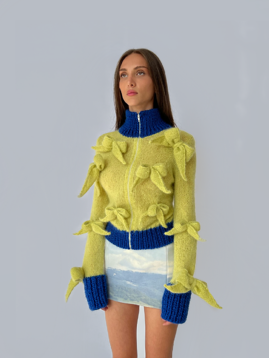Yellow knitted sweater with bows