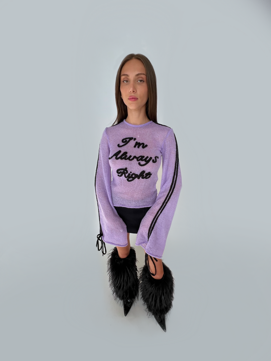 Purple sweater with writing and long sleeves