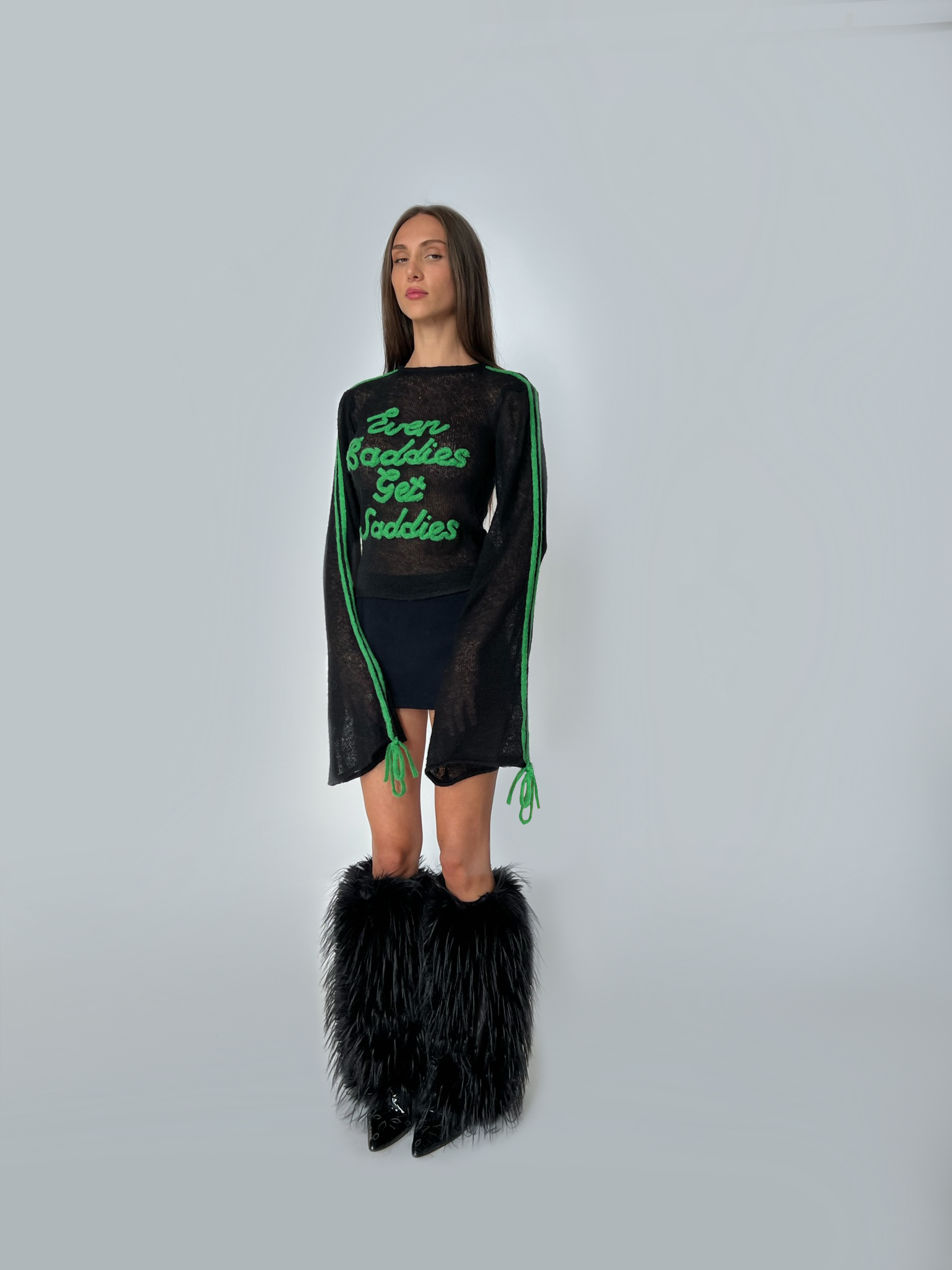 Black and green sweater with writing and long sleeves