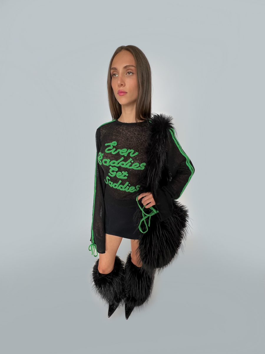 Black and green sweater with writing and long sleeves