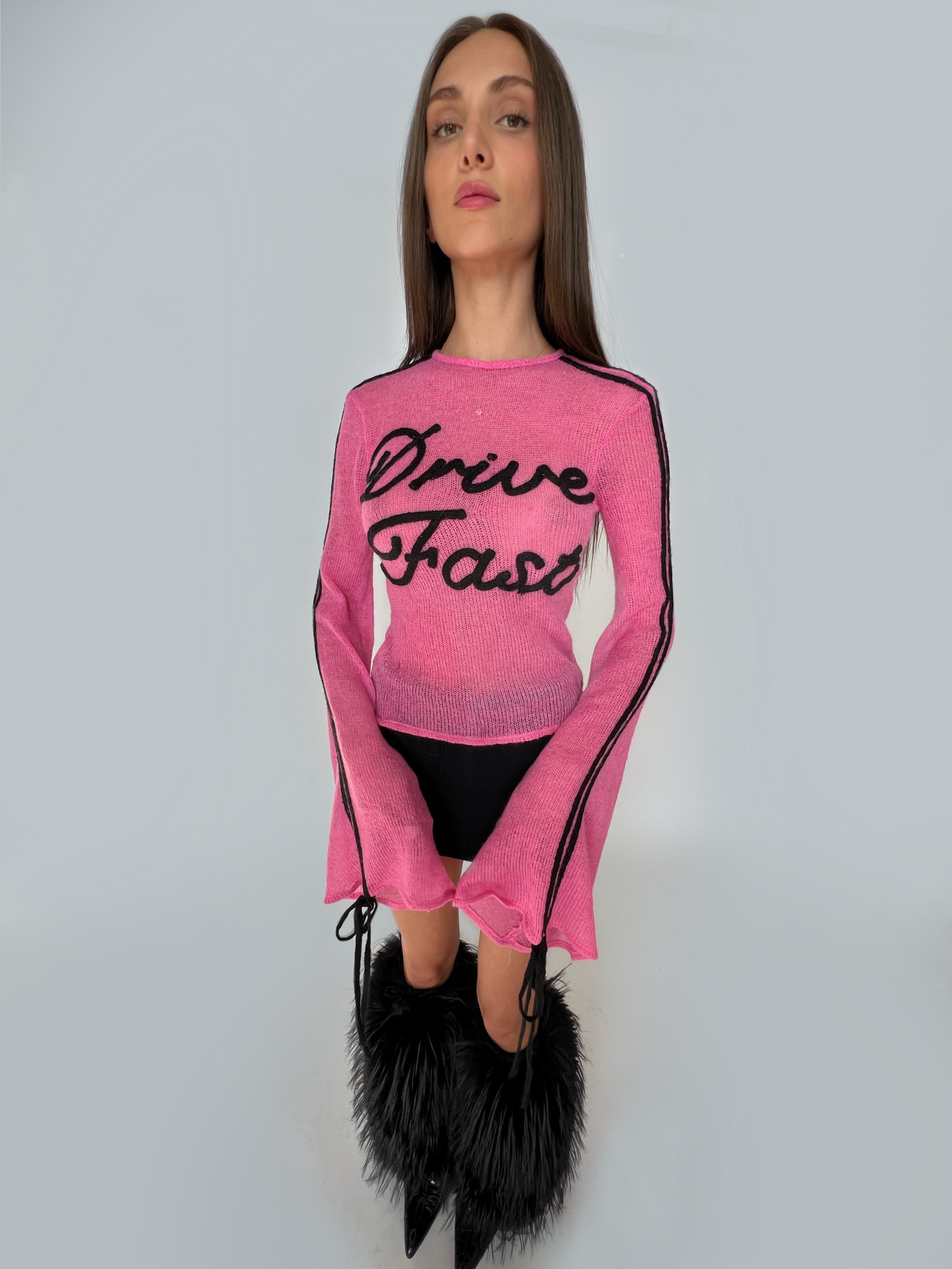 Pink sweater with writing and long sleeves