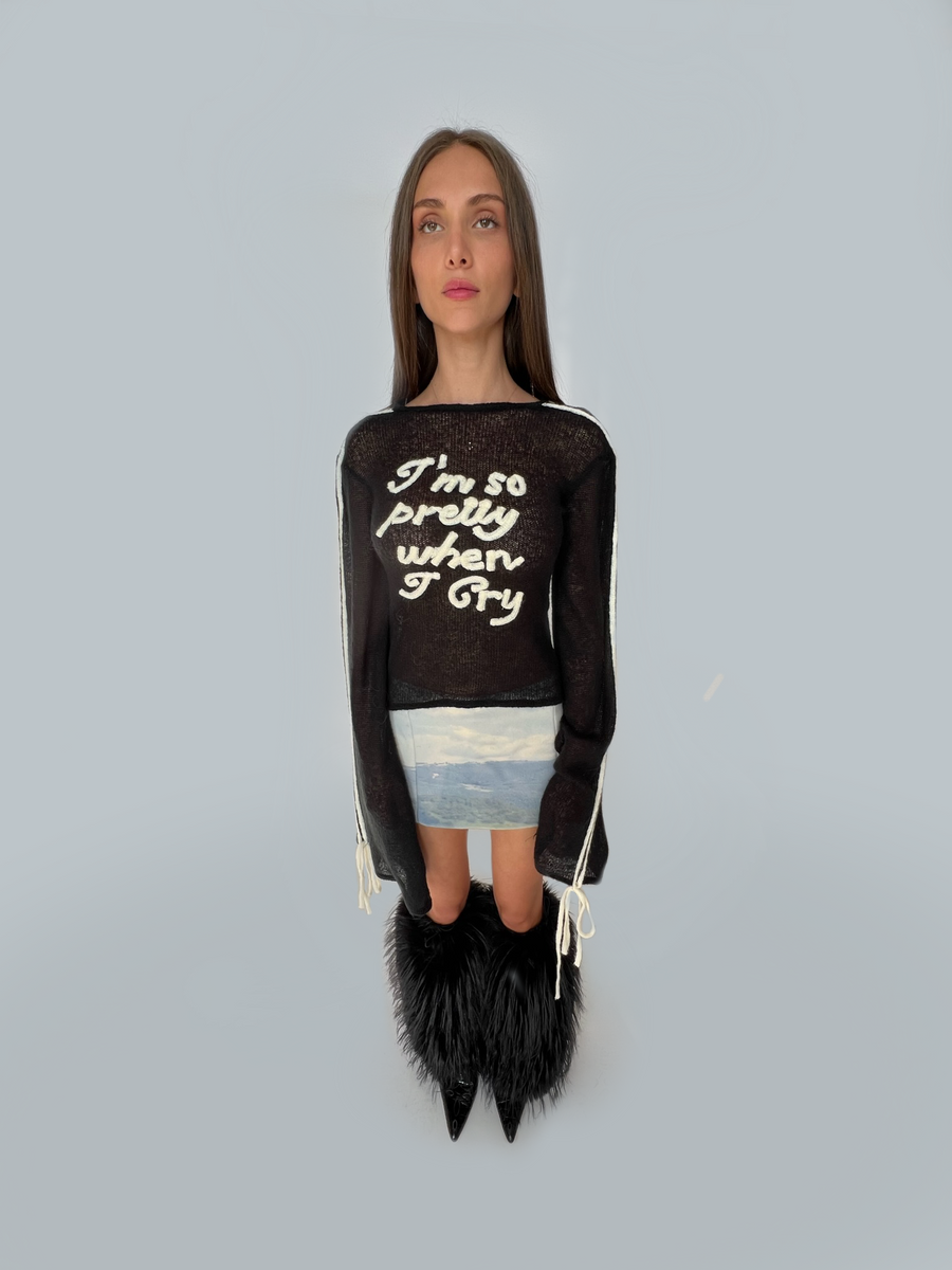 Black sweater with writing and long sleeves