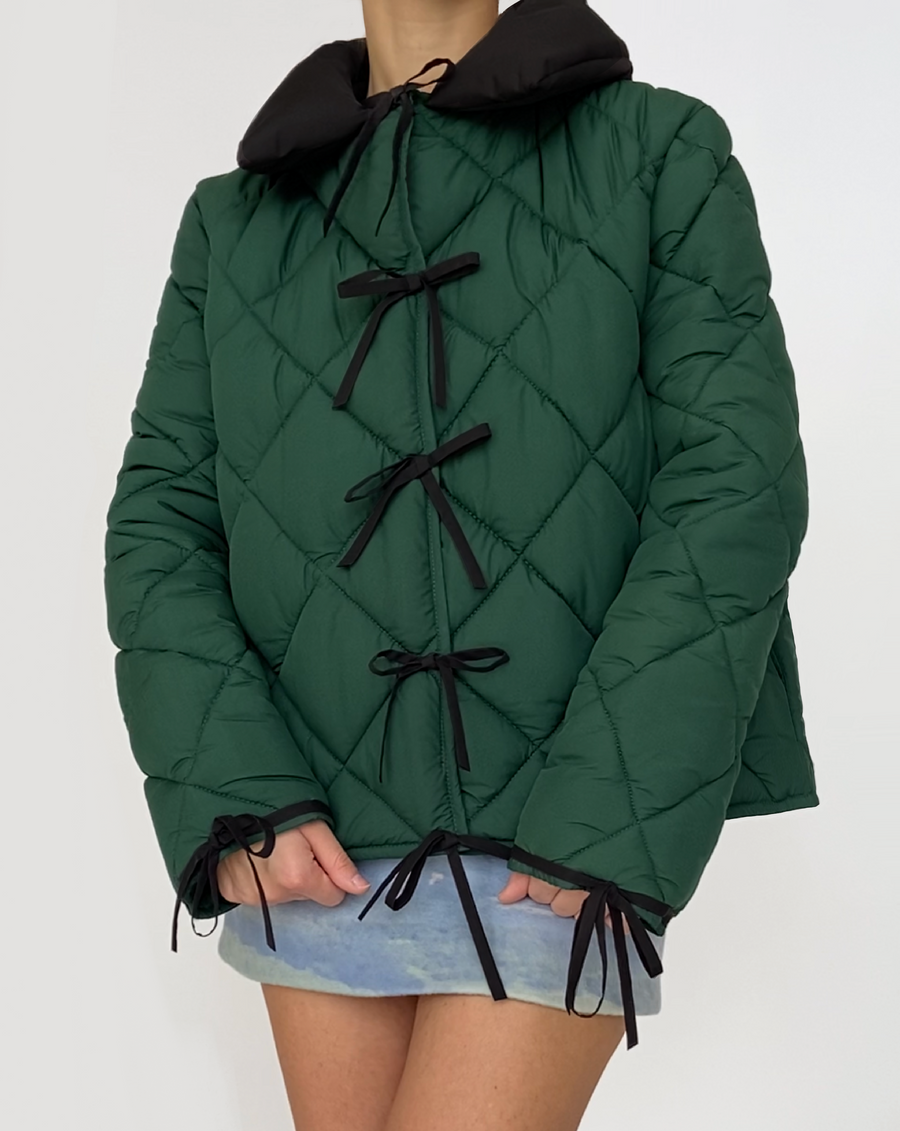 Green puffer jacket with bows