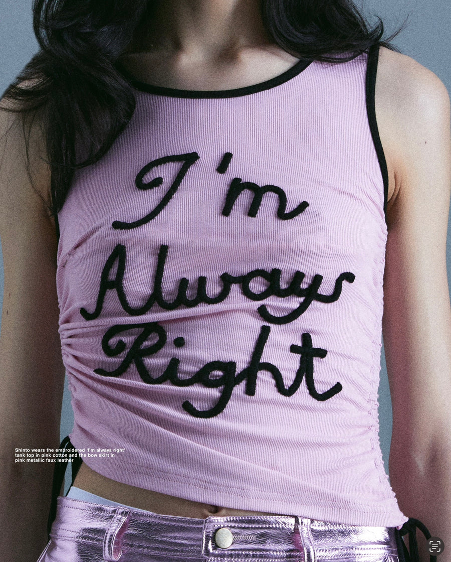 Pink tank top with embroidered words