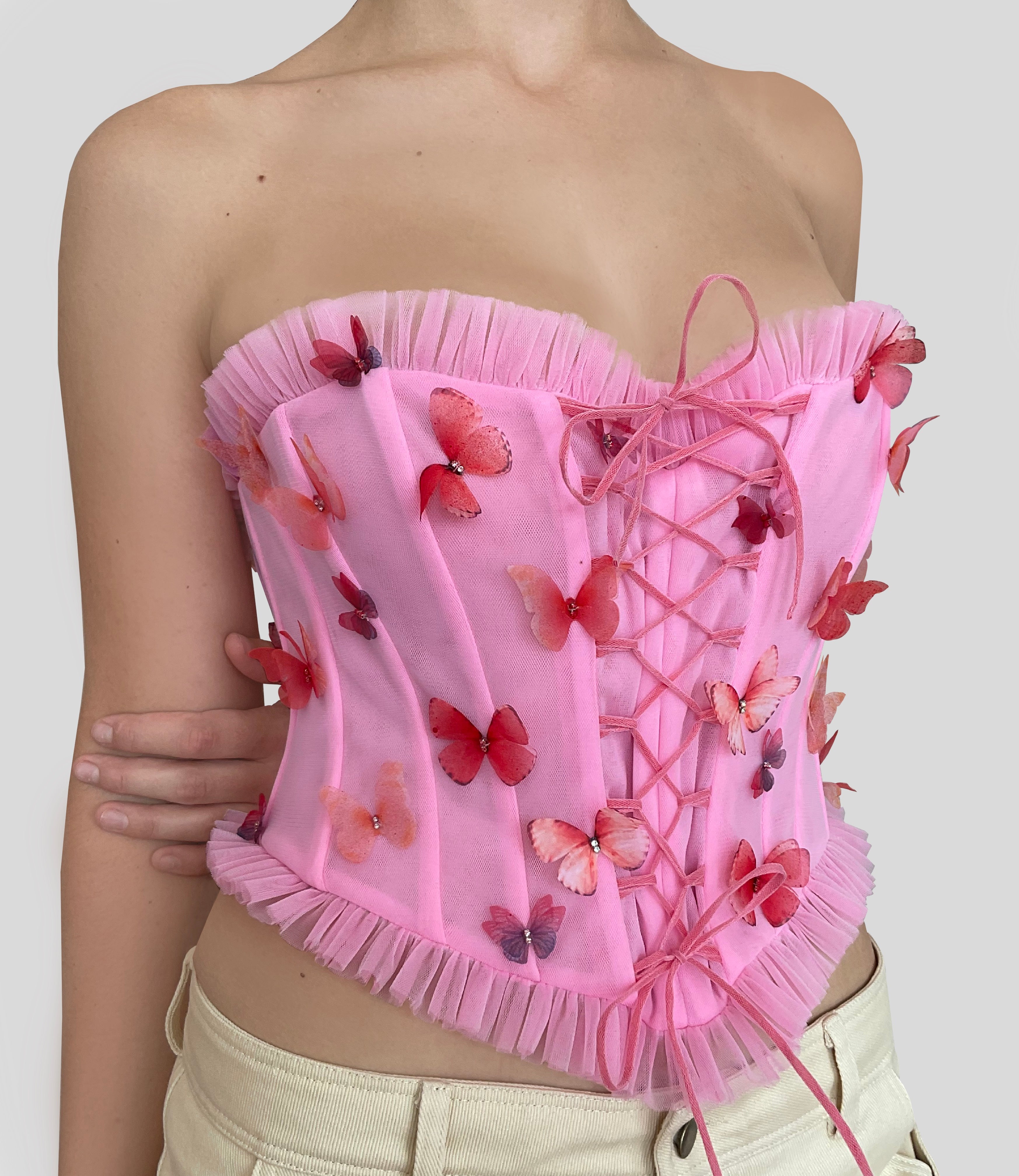Pink corset with embroidered butterflies