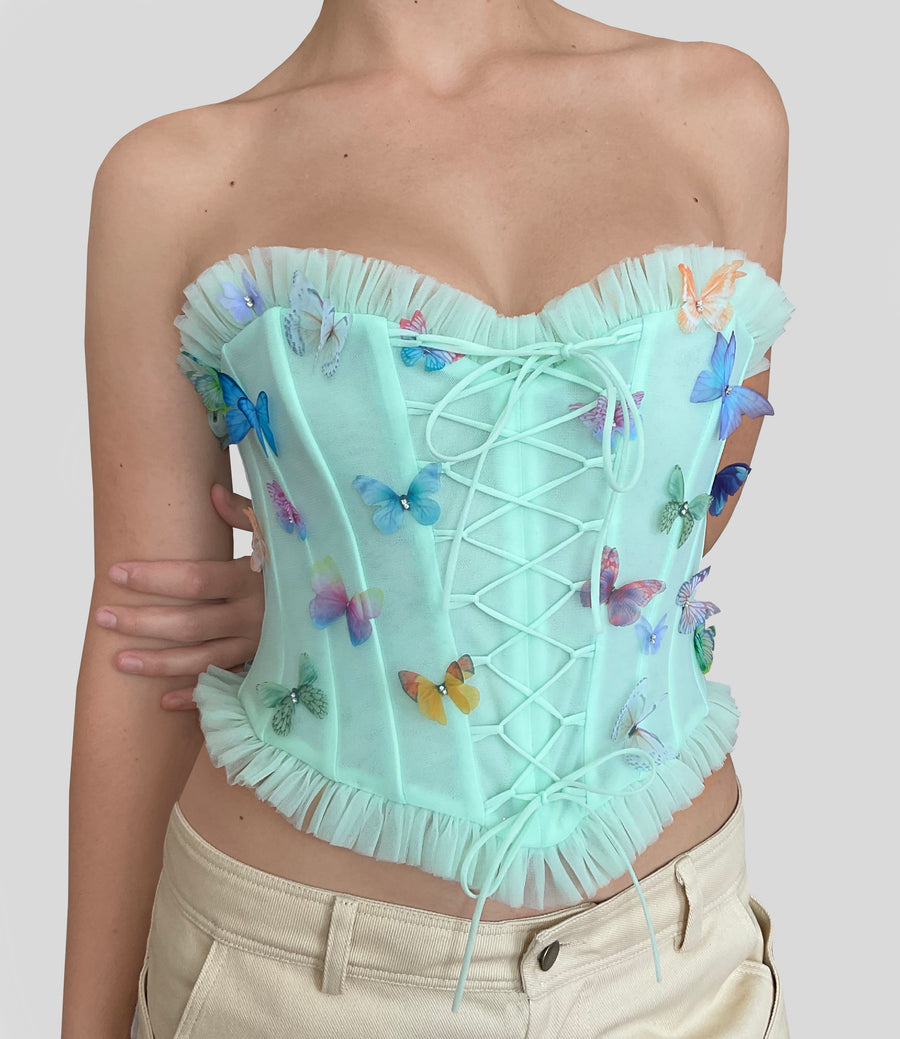 Green corset with embroidered butterflies