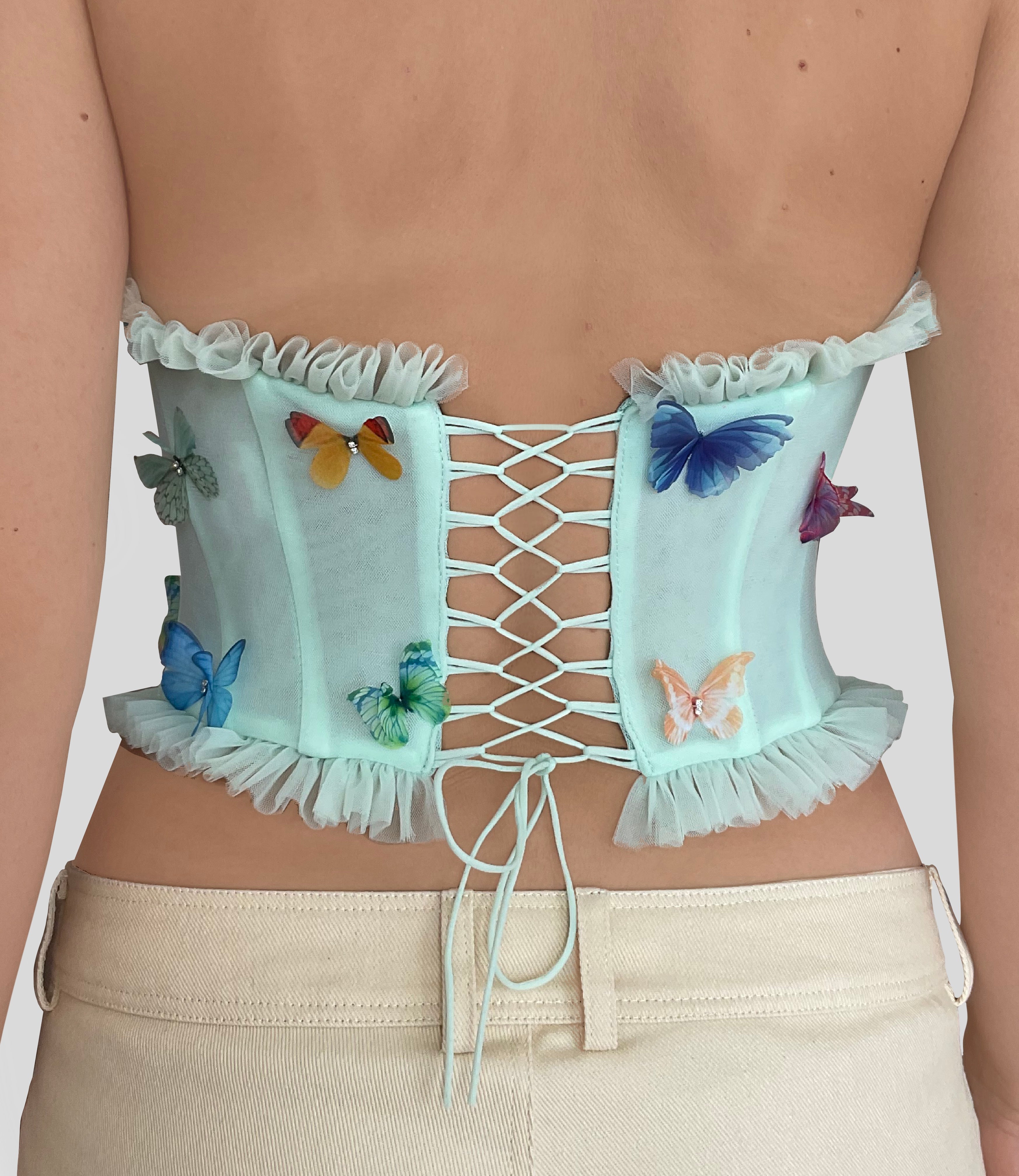 Green corset with embroidered butterflies