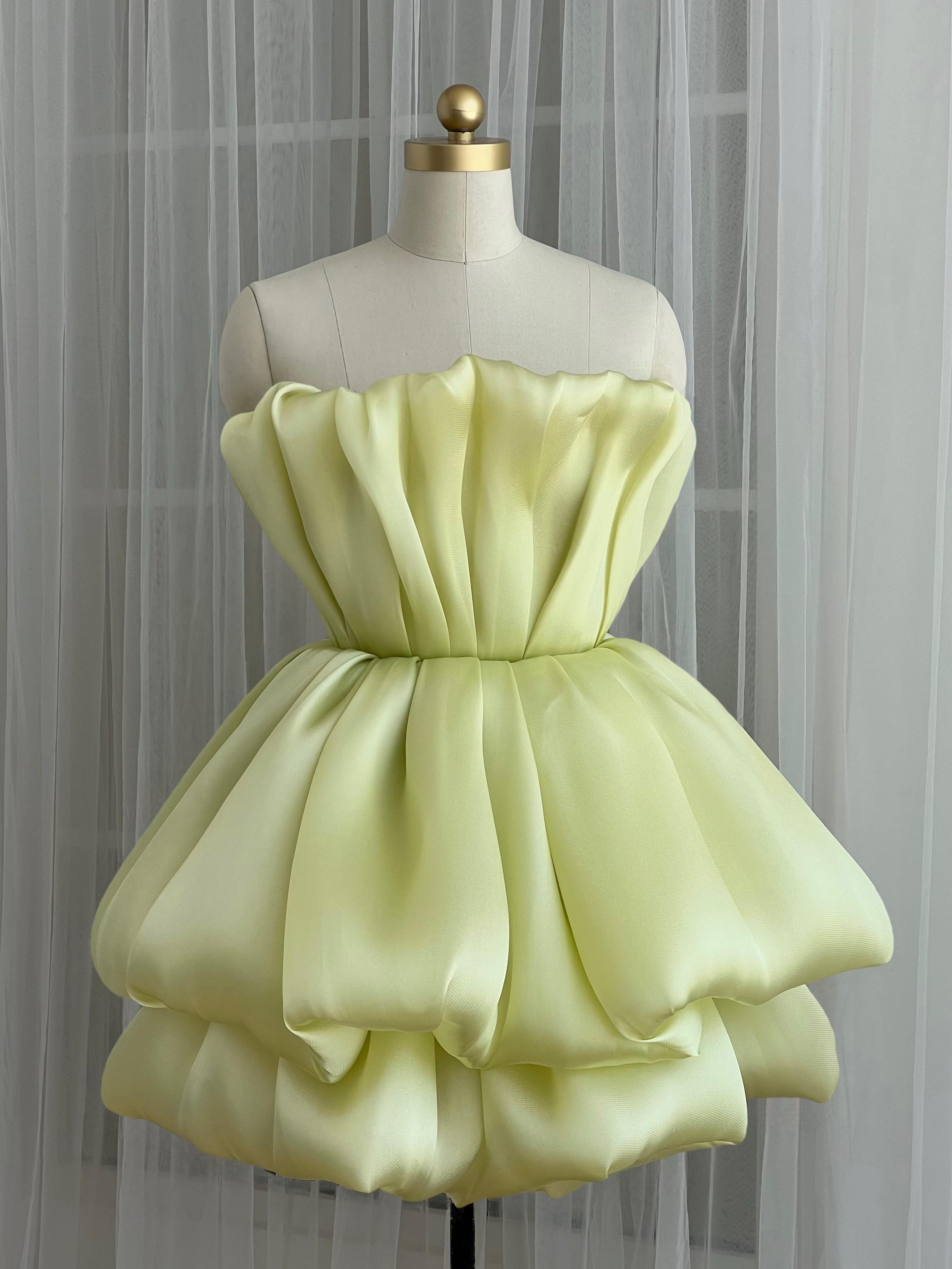 Yellow mini dress with ruffles