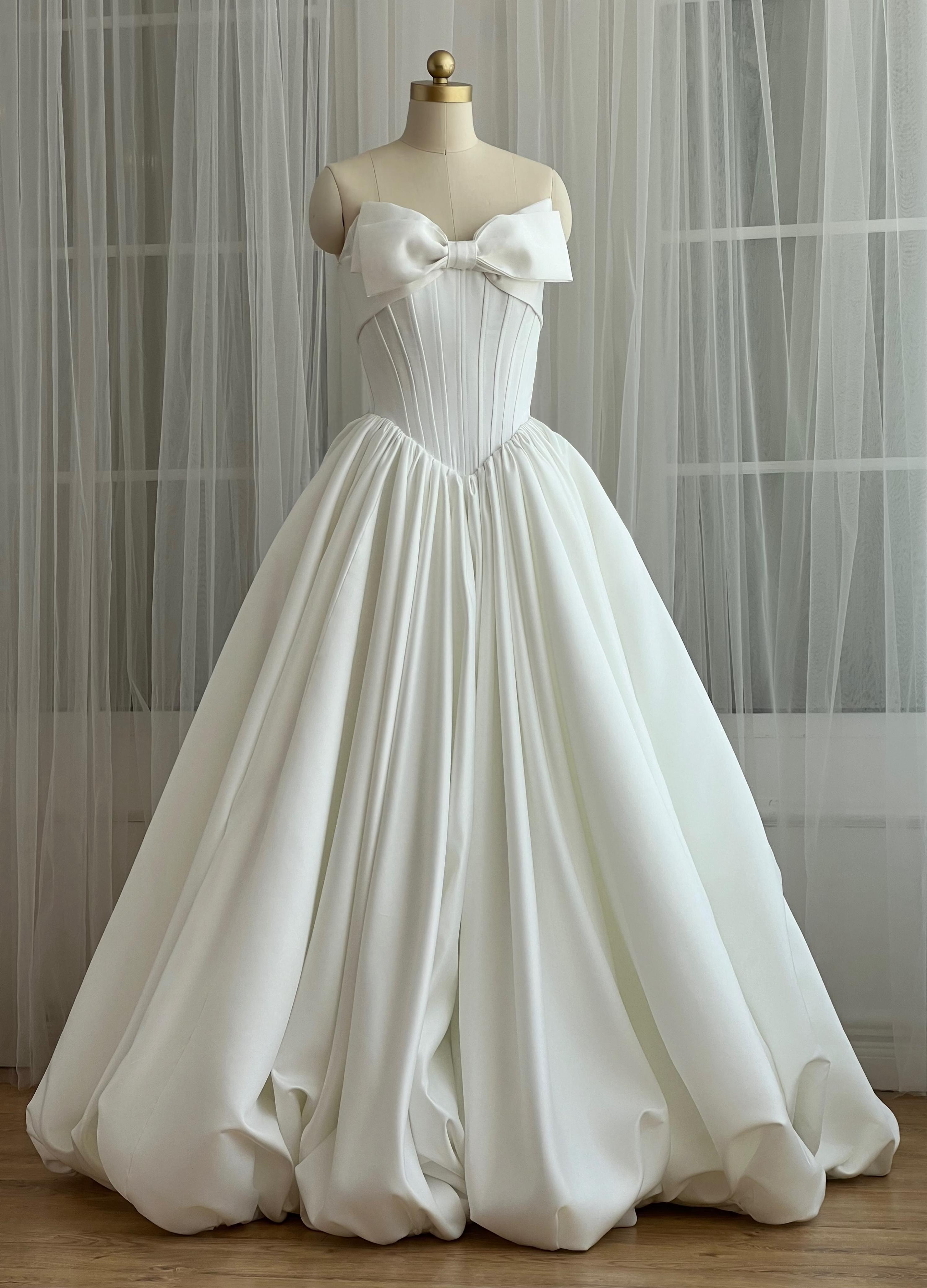 White A-Line maxi dress with a large embroidered bow