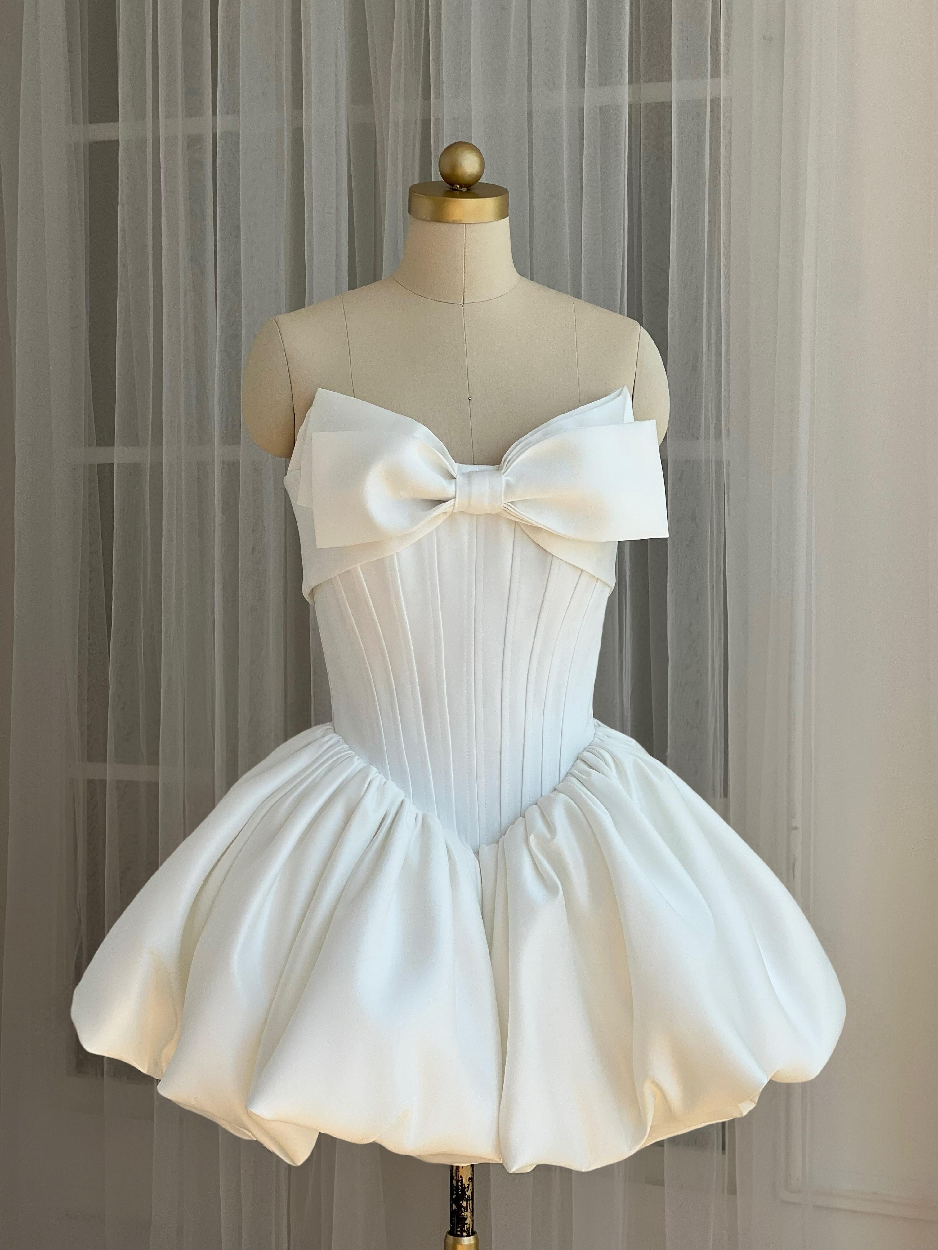 White A-Line mini dress with a large embroidered bow
