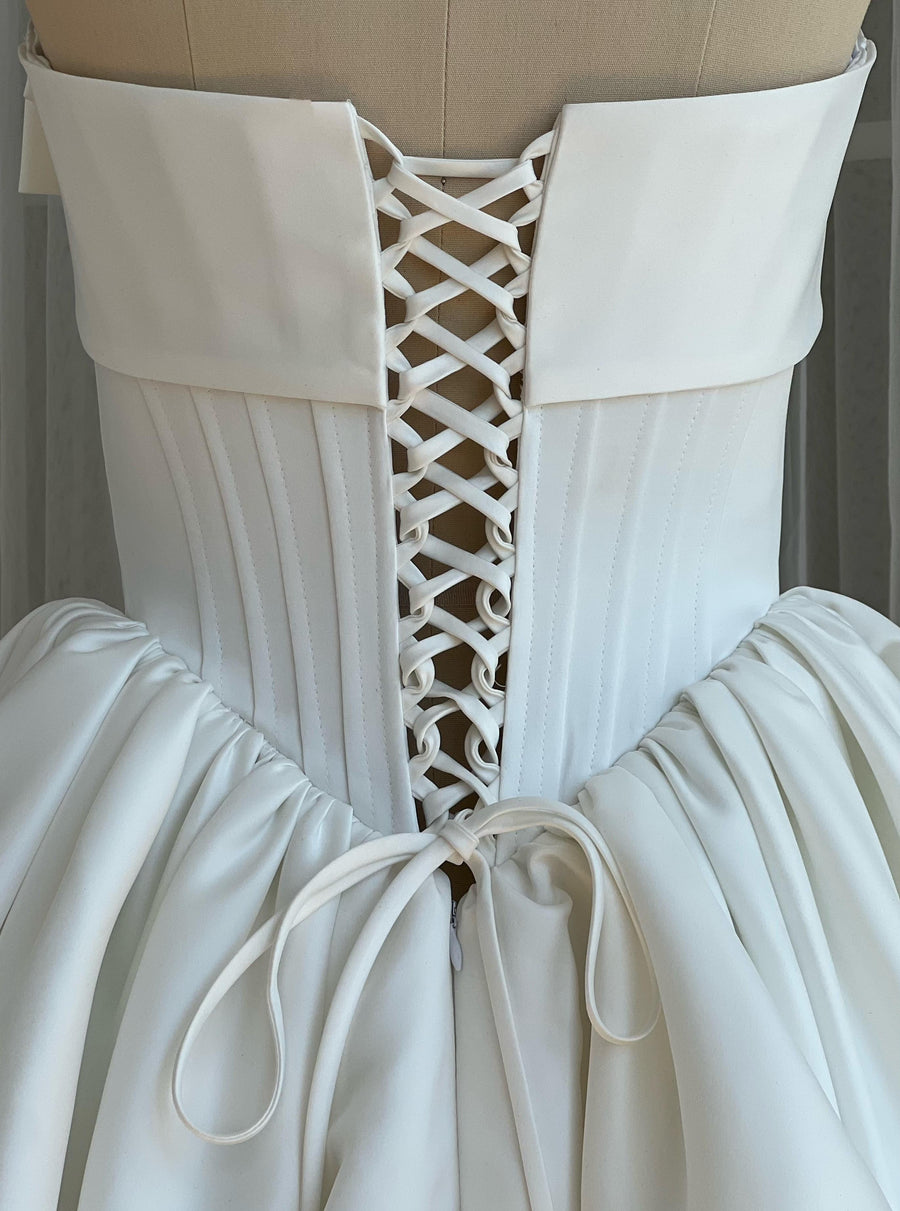 White A-Line maxi dress with a large embroidered bow