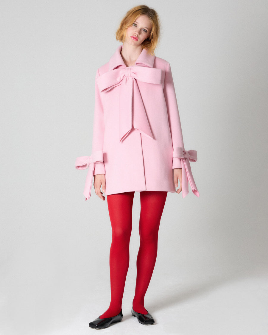 pink coat with bows