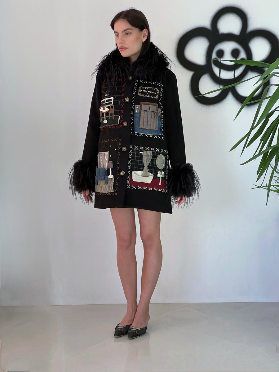 Black wool coat with apartment like embroidered figures and black faux fur