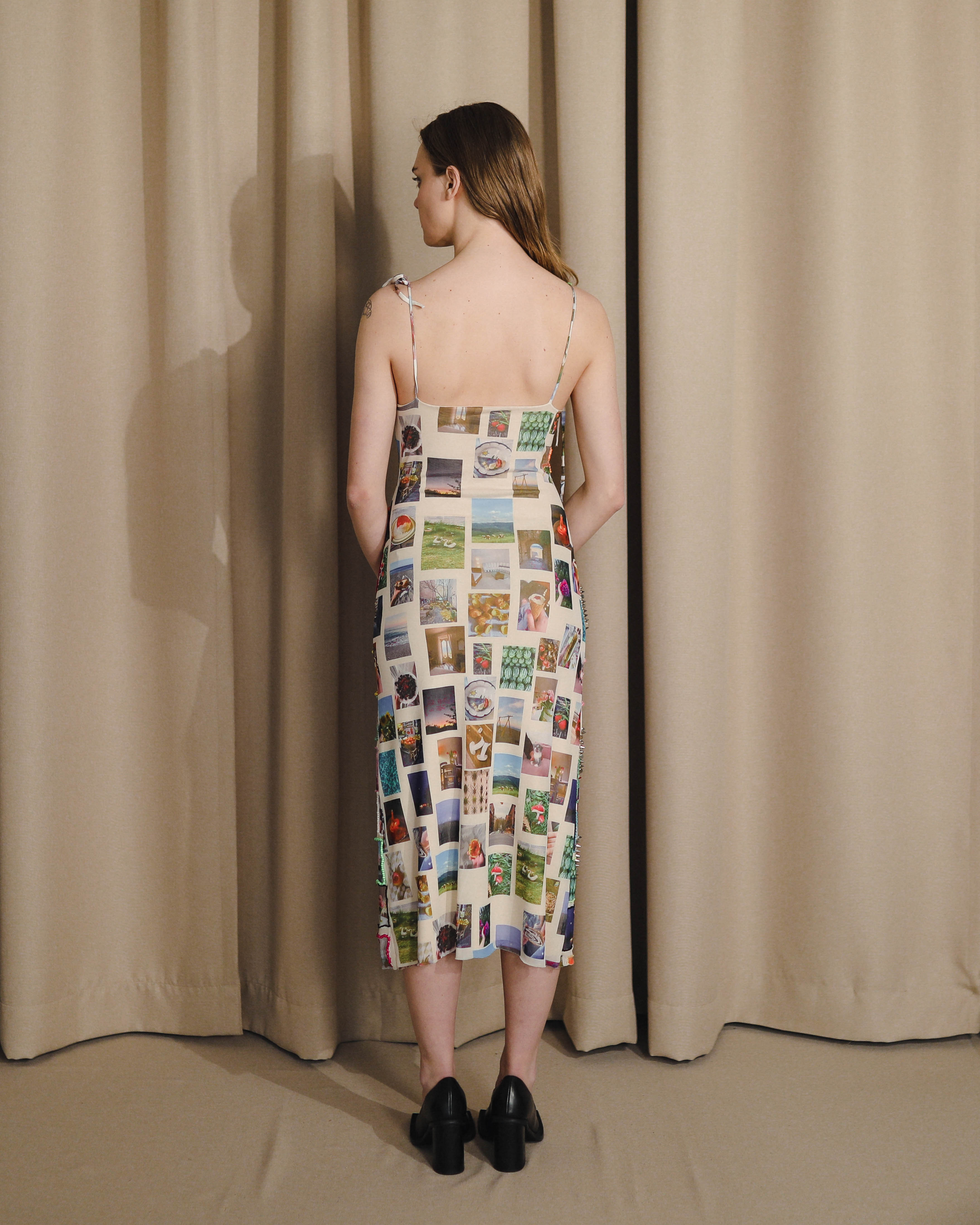 beaded dress with embroidered pictures and straps